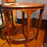 An Edwardian oval mahogany lamp table raised on tapered legs, H.74 W.58 D.28cm