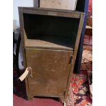 An industrial metal cabinet, with single door enclosing shelves raised on bracket supports, H.98cm