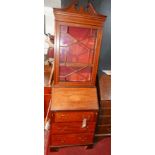 An Edwardian mahogany and inlaid bureau bookcase, with an astragal glazed top over fall front