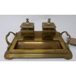 An Art Nouveau brass inkwell stamped W.T&S