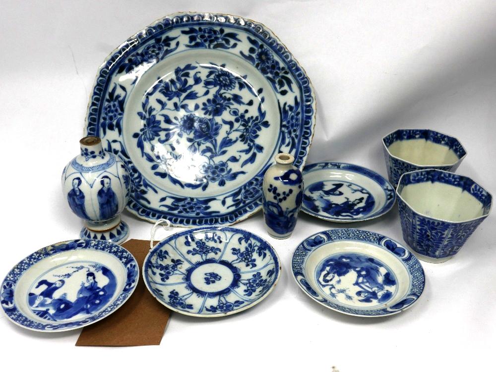 A collection of 18th century Chinese blue and white porcelain to include 1 plate, 11 dishes, 11 cups