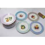 A collection of thirteen hand painted porcelain plates