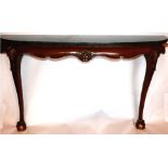A Chippendale style mahogany console table, with marble top, raised on ball and claw feet, H.77 W.