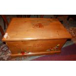 A 20th Continental pine blanket chest with painted decoration, H.42cm W.82cm D.47cm