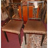 A pair of early 20th century Chinoiserie black lacquered salon chairs, with golden velour stuff over