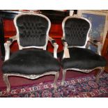 A pair of French Louis XV style silvered fauteuils with black plush velour upholstery, H.96cm W.58cm