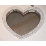 A contemporary heart shaped wall mirror with a mirrored mosaic cushion farme, H.93cm W.110cm