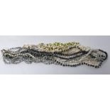 Two freshwater pearl strand necklaces to include a long 5-strand grey and white pearl necklace, L.