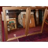A pair of contemporary gilt mirrors with bevelled plates, 87 x 61cm