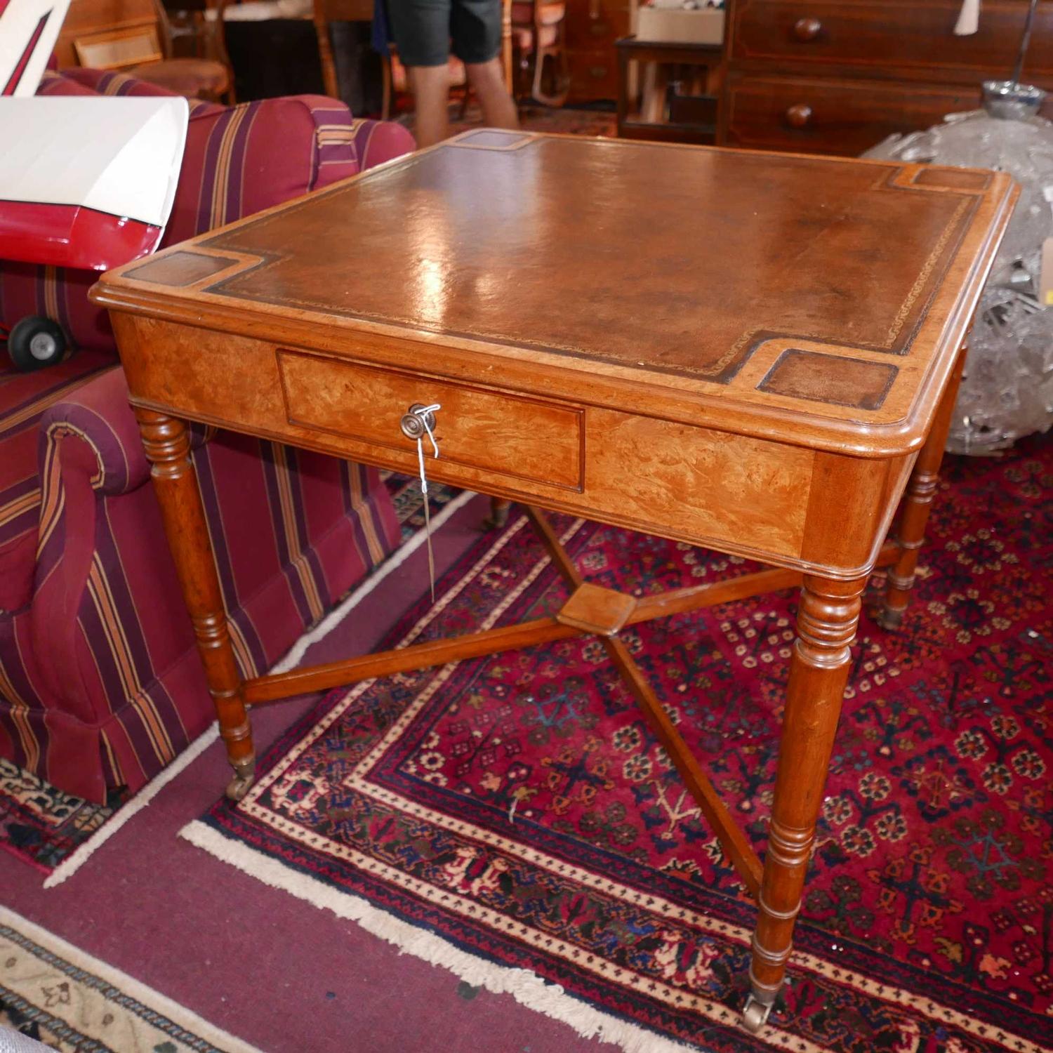 An Arthur Brett & sons walnut card table, brown leather top, two drawers one with brass makers