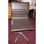 An ICF swivel desk chair, upholstered in soft brown leather over chrome base, H.100cm