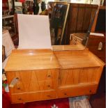 A mid 20th century satin birch dressing table, with mirror over an arrangement of sliding doors