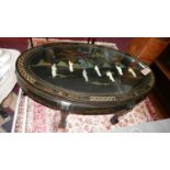 A Chinese hardstone black lacquered oval low table inset with figures, together with matching