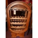 A mid 20th century slatted pine wine rack, H.124cm W.67cm D.35cm