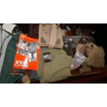 A collection of WWII military items to include a gas mask in canvas bag, Morse code machine,