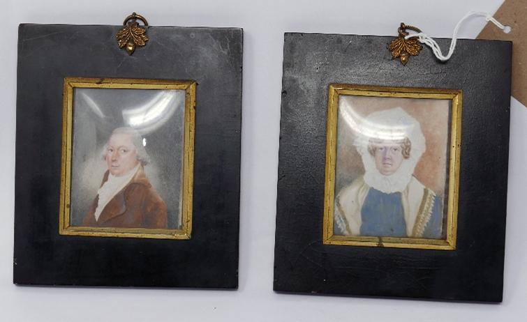 A pair of 19th century miniature portraits on paper in ebonized frames