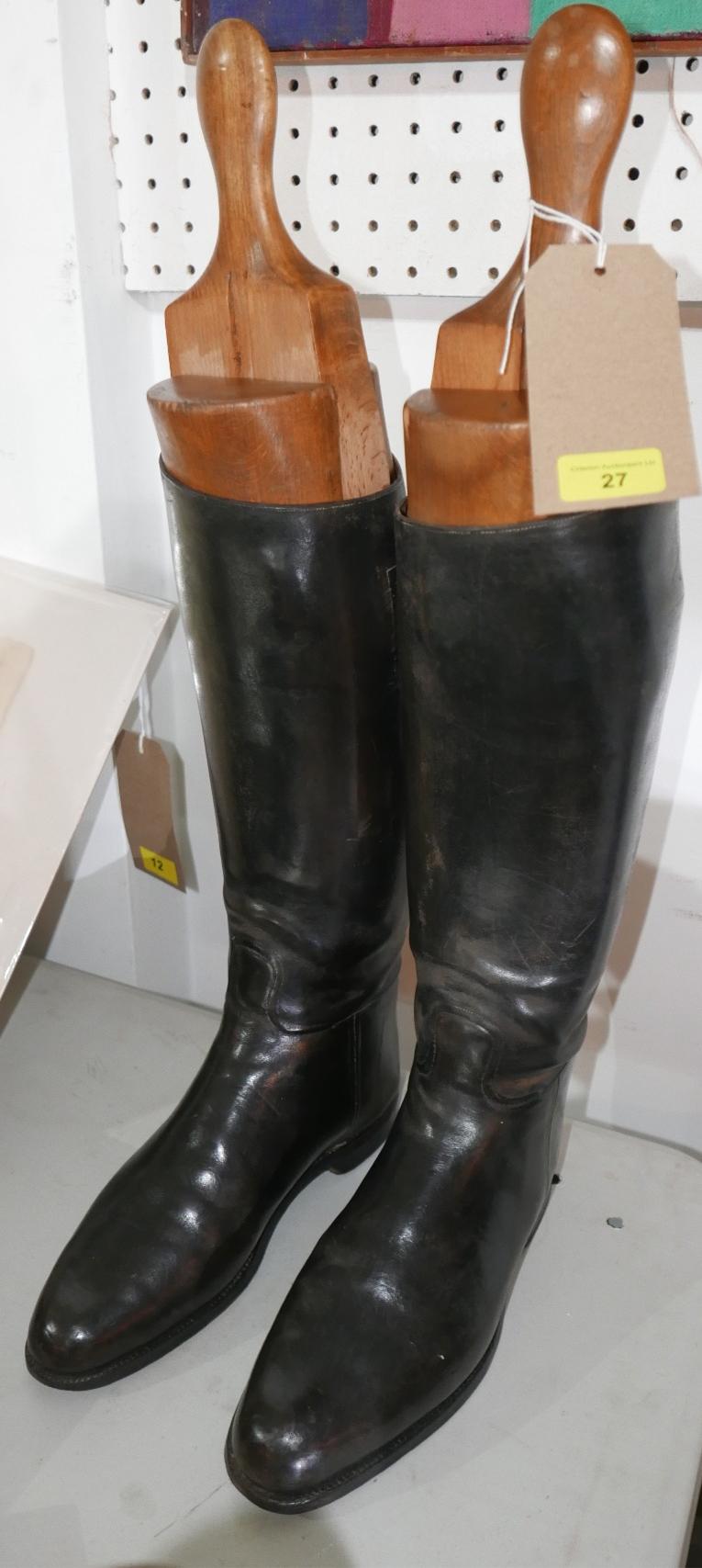 A pair of black leather riding boots, together with boot trees, H.44cm (boots)