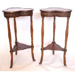 A pair of French inlaid mahogany lamp tables, having brass mounts with trefoil tops, raised on