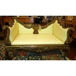 A Rococo style giltwood sofa with faux leather upholstery