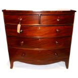 A 19th century mahogany bow front chest, with two short over three long drawers, raised on splayed