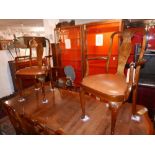 A set of 8 early 20th century Queen Anne style walnut dining chairs, to include two carvers, with
