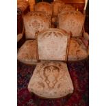 A set of six early 20th century French parcel gilt walnut chairs, to include 3 armchairs, with