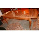 A H.L Epstein inlaid burr walnut dining table, with extra leaf, raised on cabriole legs, with makers