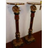 A pair of French empire style walnut and ormolu jardiniere stands, with rams head finials having