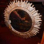 A cast aluminium framed sunburst mirror, with aged plate, Diameter. 89cm