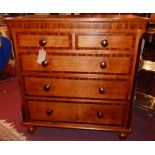 A 19th century oak and mahogany crossbanded chest, with two short over three long drawers, raised on