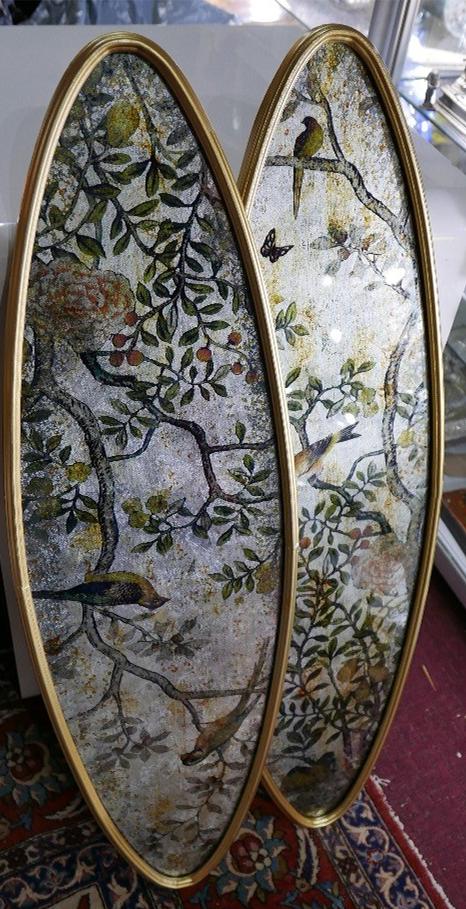 A pair of prints of birds on perspex in elliptical formed gilt frames, H.90cm W.28cm (2)