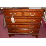 An early 20th century mahogany and boxwood inlaid chest of two short over three long drawers, on