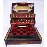 A 19th century mahogany and marquetry inlaid games compendium, to include a bone chess set,