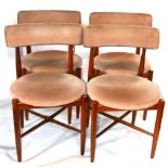 A set of four mid 20th century G-plan teak dining chairs, with velour upholstery