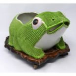 A large 19th century Chinese export porcelain lucky frog planter on fitted lily pad carved wood