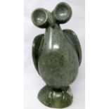 A green marble carving of an owl, H.36cm