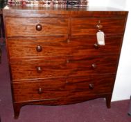 An early 19th century mahogany and ebony inlaid chest, with two short over three long drawers,