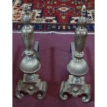 A pair of brass and cast metal fire dogs, with knopped finials, H.62 L.45cm