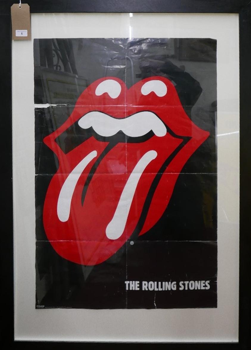 A framed and glazed Rolling Stones poster, 90 x 60cm