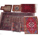 A Persian prayer rug, together with 3 saddle bags and 2 small rugs