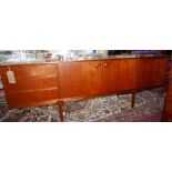 A mid 20th century A.H Mcintosh teak sideboard, with three drawers and three cupboard doors,