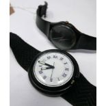 Two Swatch watches, to include a black Swatch with vortex design dial marked AG 1986, and a Pop