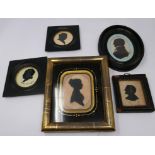 A collection of six framed Victorian silhouettes, largest 9 x 6cm, one with cracked glass