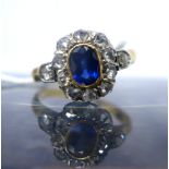 A Georgian 18ct yellow gold rose-cut diamond and sapphire cluster ring, the central, oval sapphire