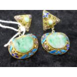 A boxed pair of antique Chinese green jade and enameled clip on earrings, each earring composed a