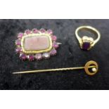 Three antique yellow gold items, to include an oval garnet-framed mourning brooch, 2 x 2.5cm, a 14ct