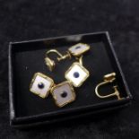 An Art Deco yellow gold, sapphire and mother of pearl dress-set, to include a matching pair of