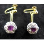 A pair of antique 18ct yellow gold and platinum, ruby and diamond cluster drop earrings, the cluster