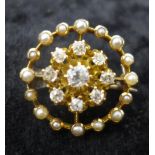 A Victorian 18ct yellow gold, diamond and pearl circular brooch, centrally set with a nine claw-