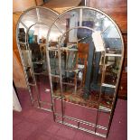 A pair of contemporary arched garden mirrors with gilt metal frames, H.107cm W.54cm (2)